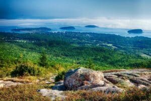 view from Cadillac Mountain in Acadia down to ocean below.