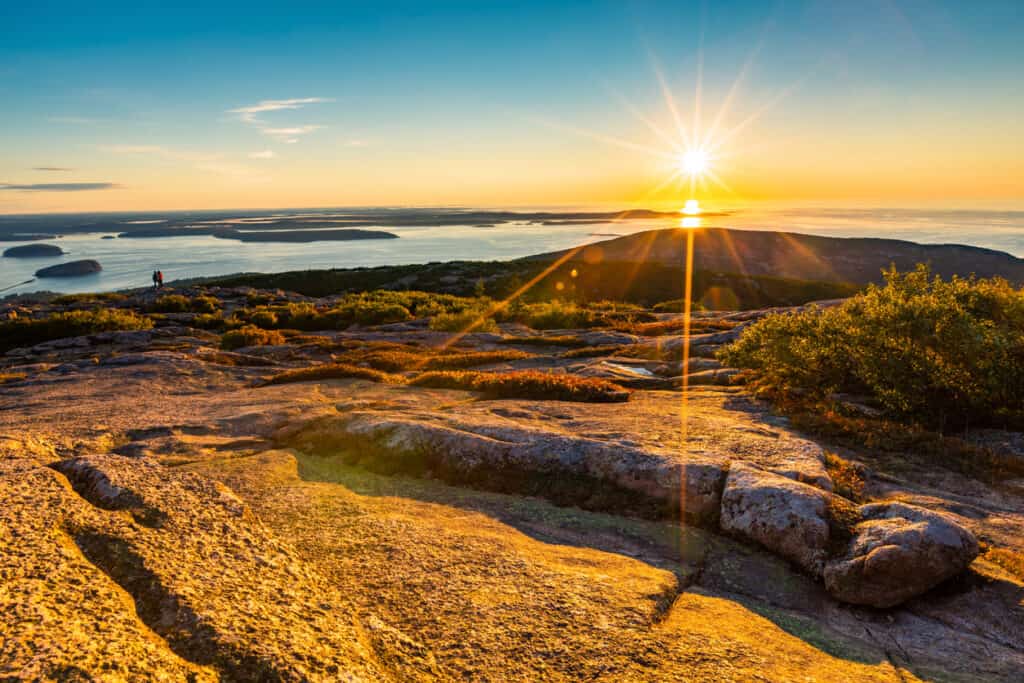 Acadia National Park Itinerary 4 Days. Sunrise over the ocean,  on top of Cadillac Mountain Maine.