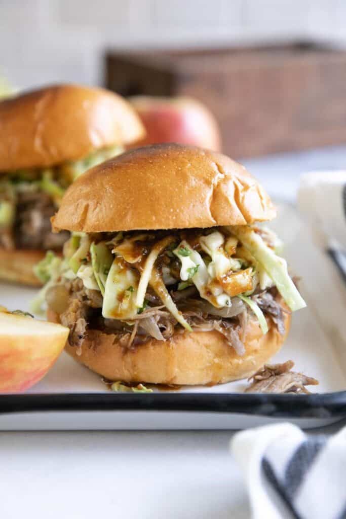 Apple cider pulled pork in buns with coleslaw