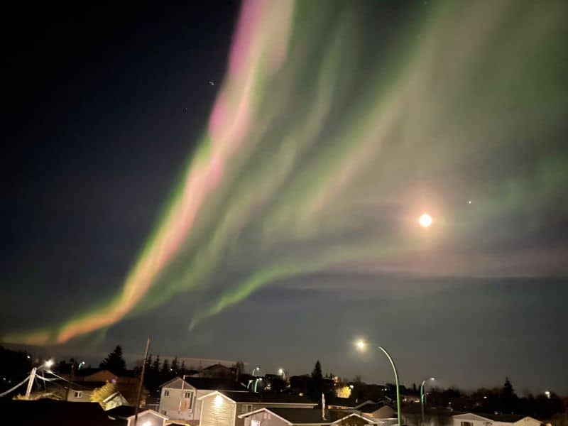 Yellowknife Aurora Viewing from a deck. 