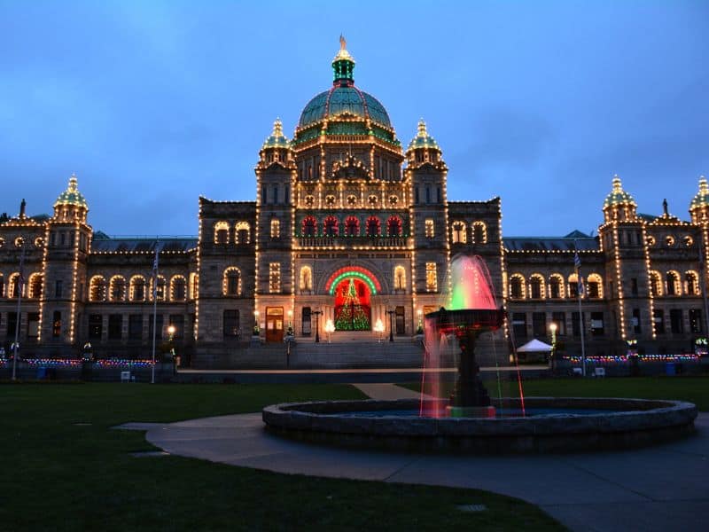 BC Parliament Buildings in Victoria lit up at night at Christmas time. 