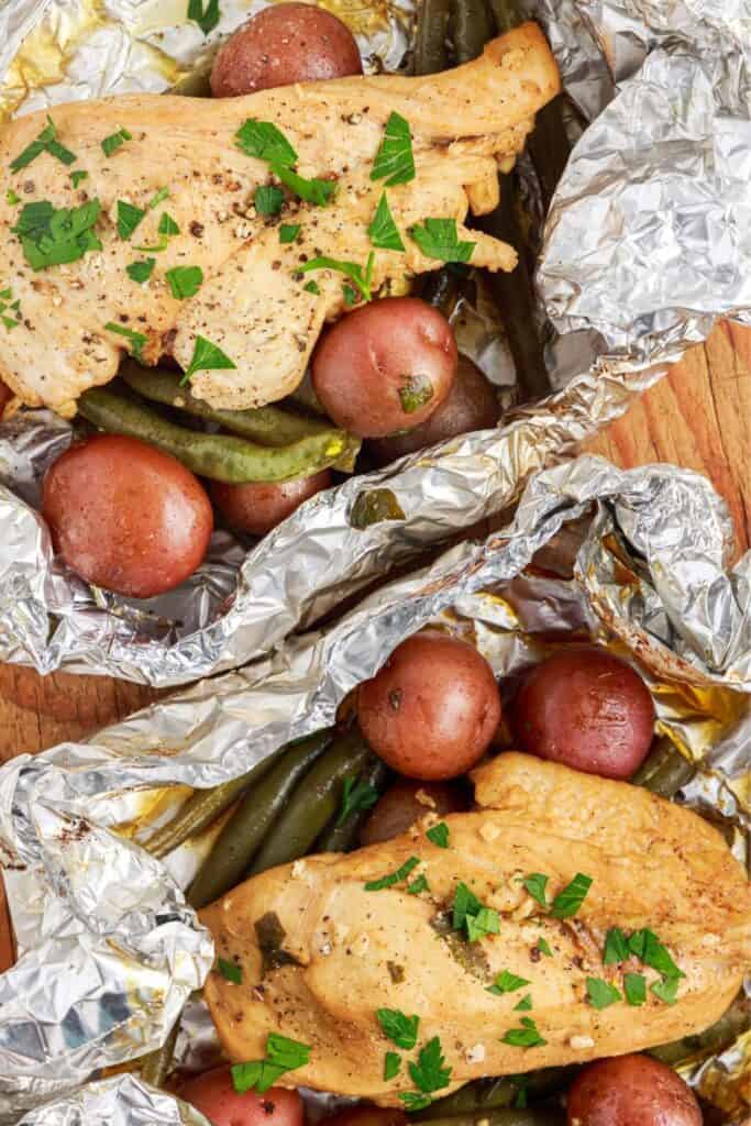 Chicken breast foil packs with baby red potatoes and green beans. 