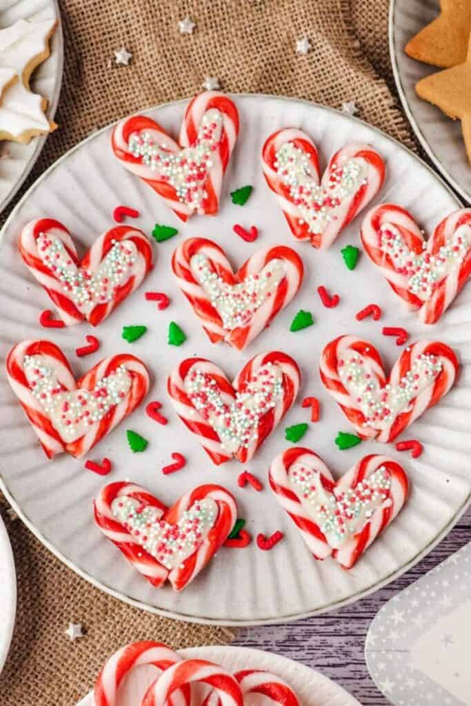 Plate of small candy cane hearts with white chocolate in the middle. 