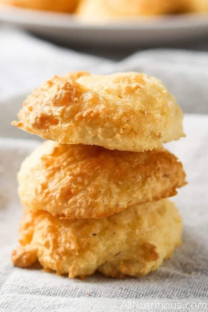 Stack of three round cheddar cheese bites. 