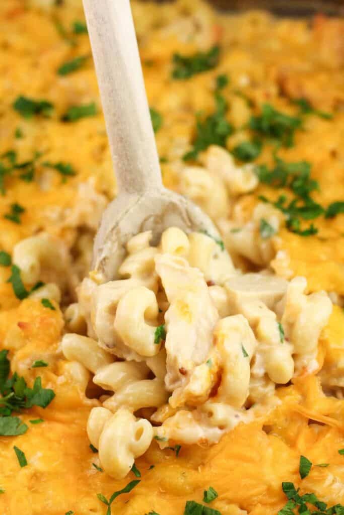 Wooden spoon in a chicken macaroni casserole. 