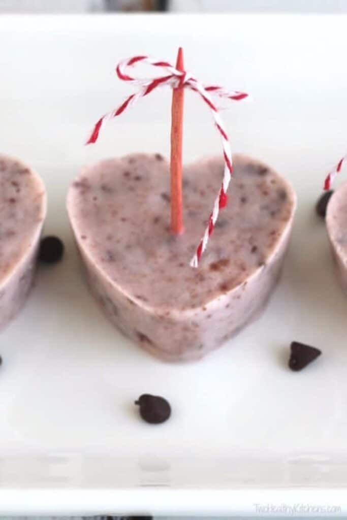 Heart shaped strawberry, chocolate popiscle bite.