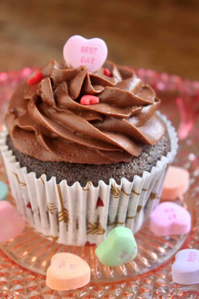Chocolate cupcake with mocah buttercream, decorated with candy hearts.