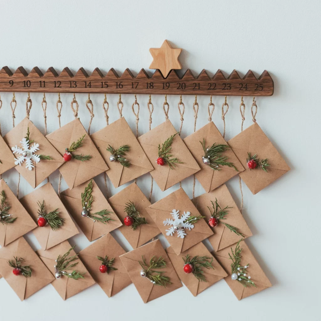 wooden advent christmas calendar with star and hooks