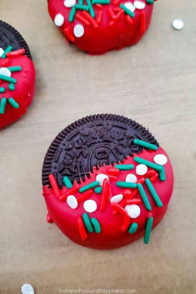 Christmas oreo dipped in red candy melts and sprinkles. 