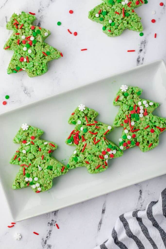 Plate full of green Christmas tree rice krispie treats. 