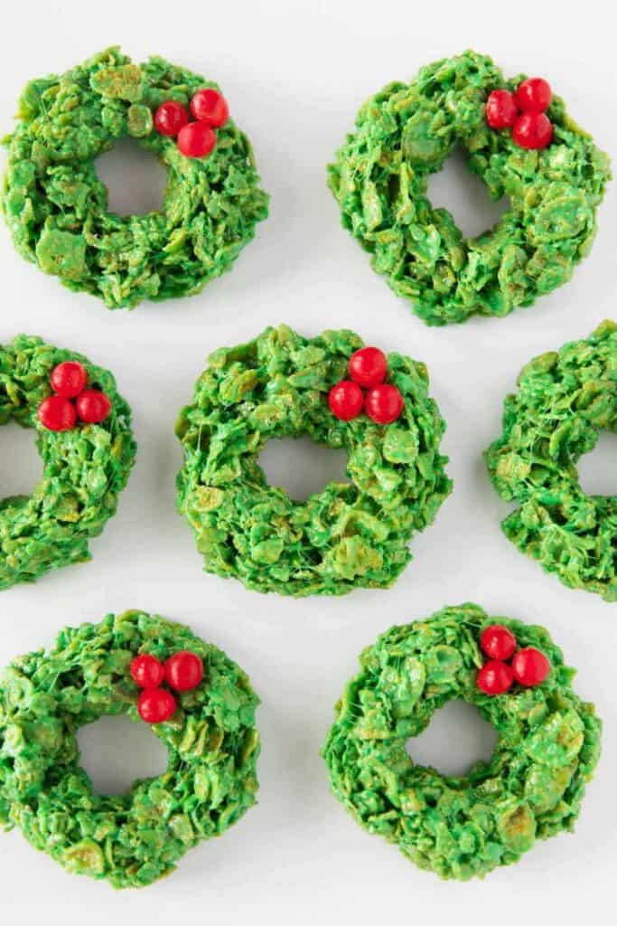 7 Green corn flake wreaths with 3 candy berries on each.