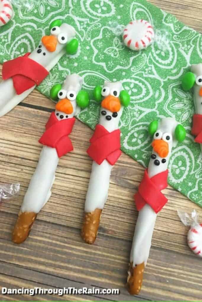 Four Snowmen Pretzel sticks with scarves. 