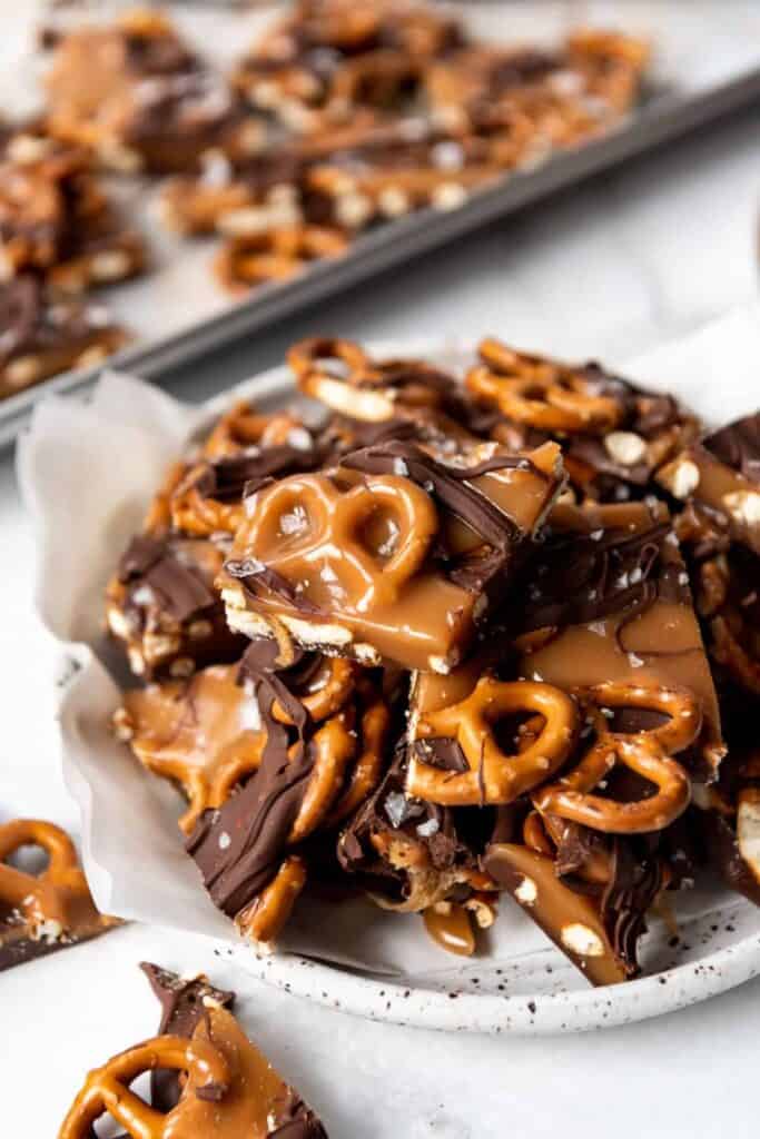 Plate piled high with Chocolate Caramel Pretzel bark dessert.  