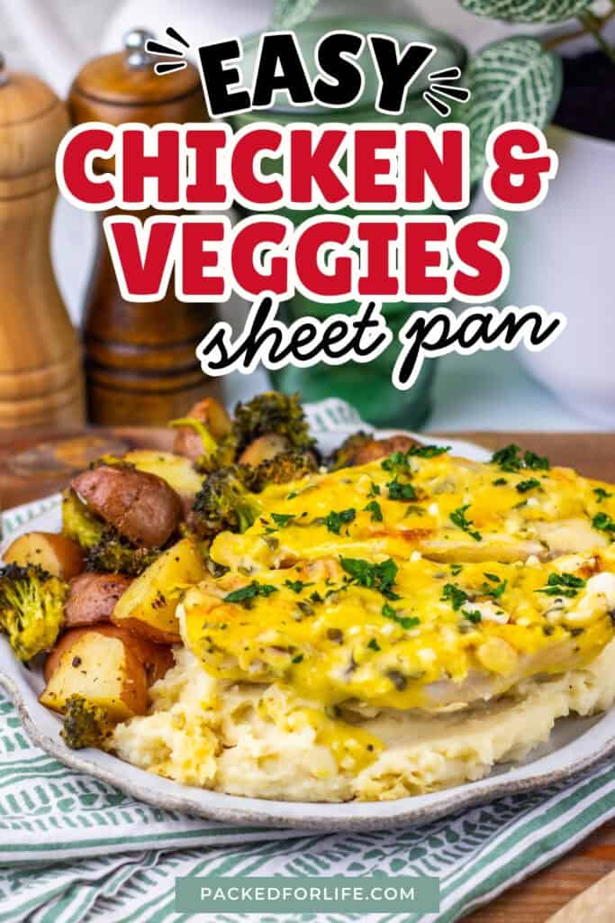 A plated sheet pan dinner featuring baked chicken breasts topped with a creamy garlic parmesan sauce, served with roasted red potatoes and broccoli for a quick and easy dinner.