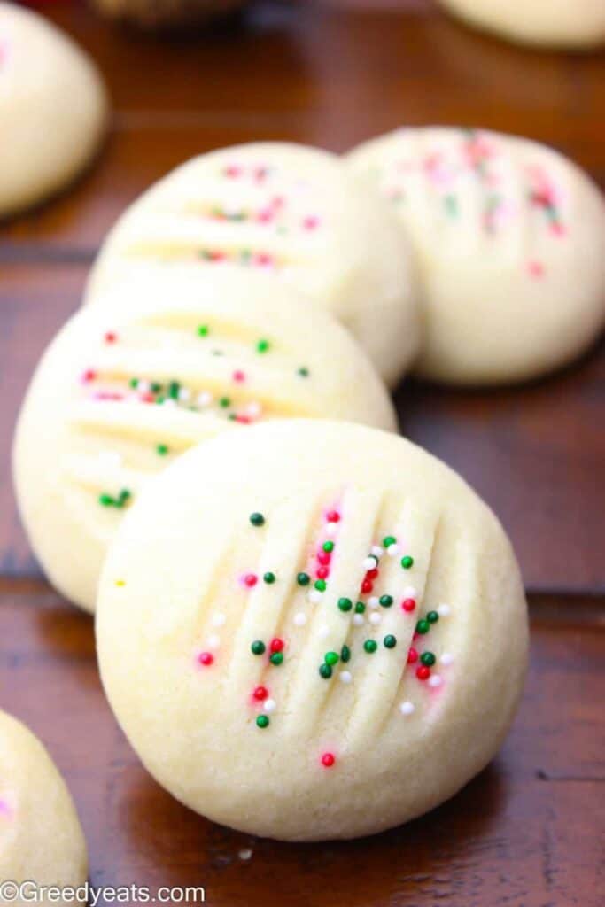 Whipped shortbread with festive sprinkles in a row.