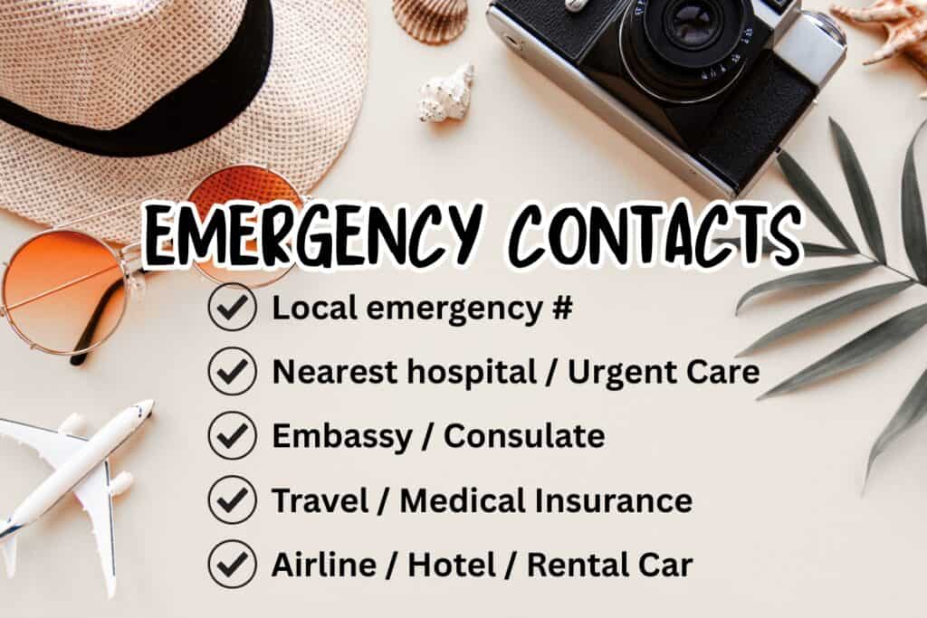 Emergency contacts text over a travel themed flat lay with a straw hat sunglasses camera airplane model and tropical leaves. The checklist reads local emergency number nearest hospital or urgent care embassy or consulate travel or medical insurance and airline hotel or rental car highlighting important emergency contacts to save before a trip.