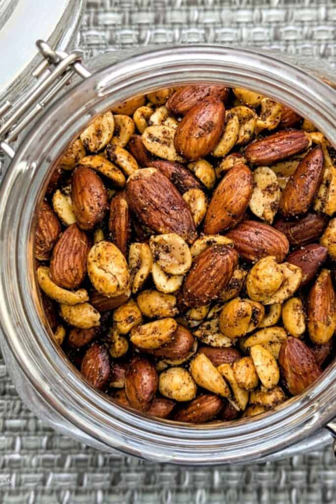 Overhead view of a glass jar filled with Ghost Pepper roasted mixed nuts.