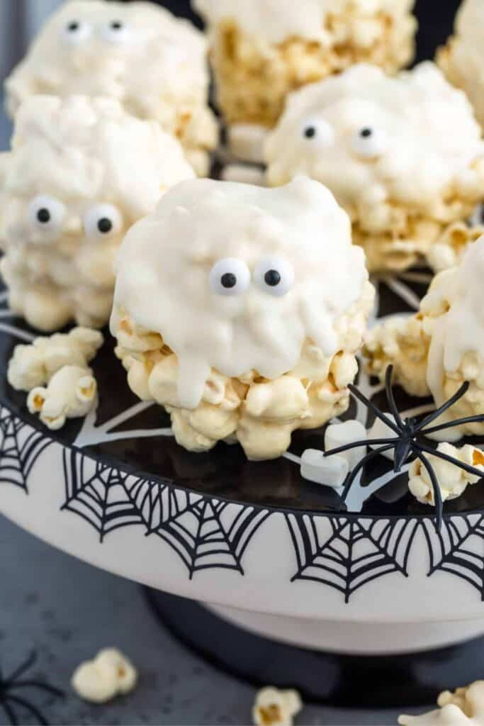 Cobweb cake plate with ghost rice krispie treats and candy eyes.