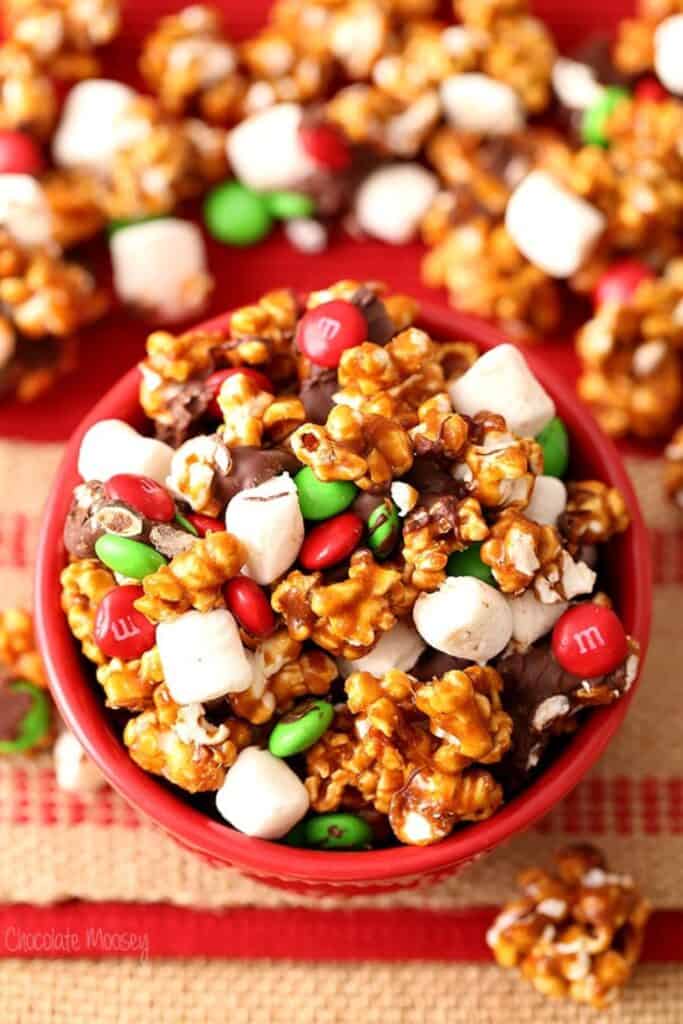 Close up of gingerbread popcorn with Chrismtas M&Ms, and mini marshmallows. 