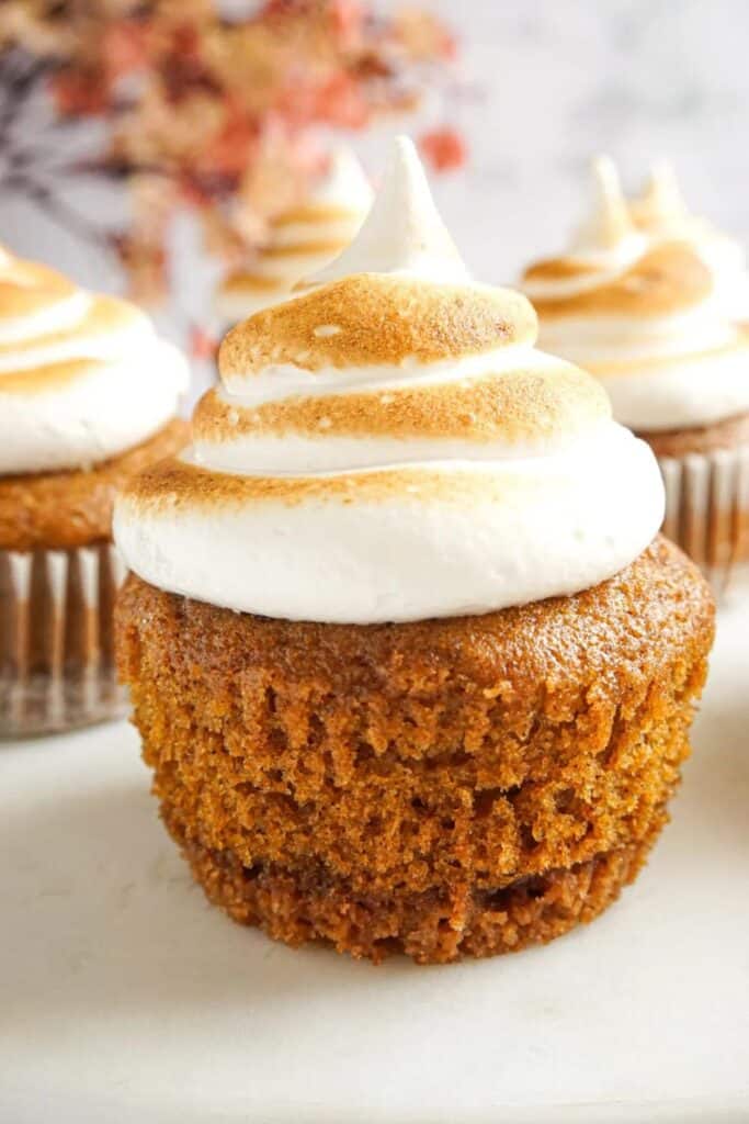 Close up of gingerbread pumpkin cupcakes with toasted marshmallow icing.