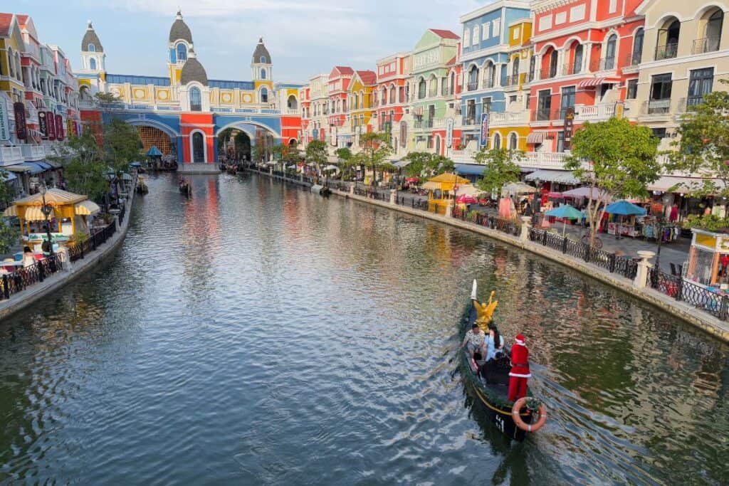 A gondola riding down Grand World's Venice River through European inspired buildings. 