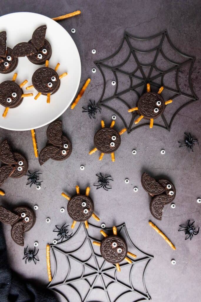 Dark background with oreo cookie spiders and bats.