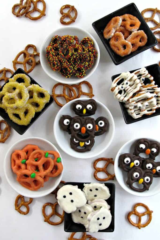 Halloween pretzles dipped in candy melts made into punpkins, owls, mummies and with sprinkles