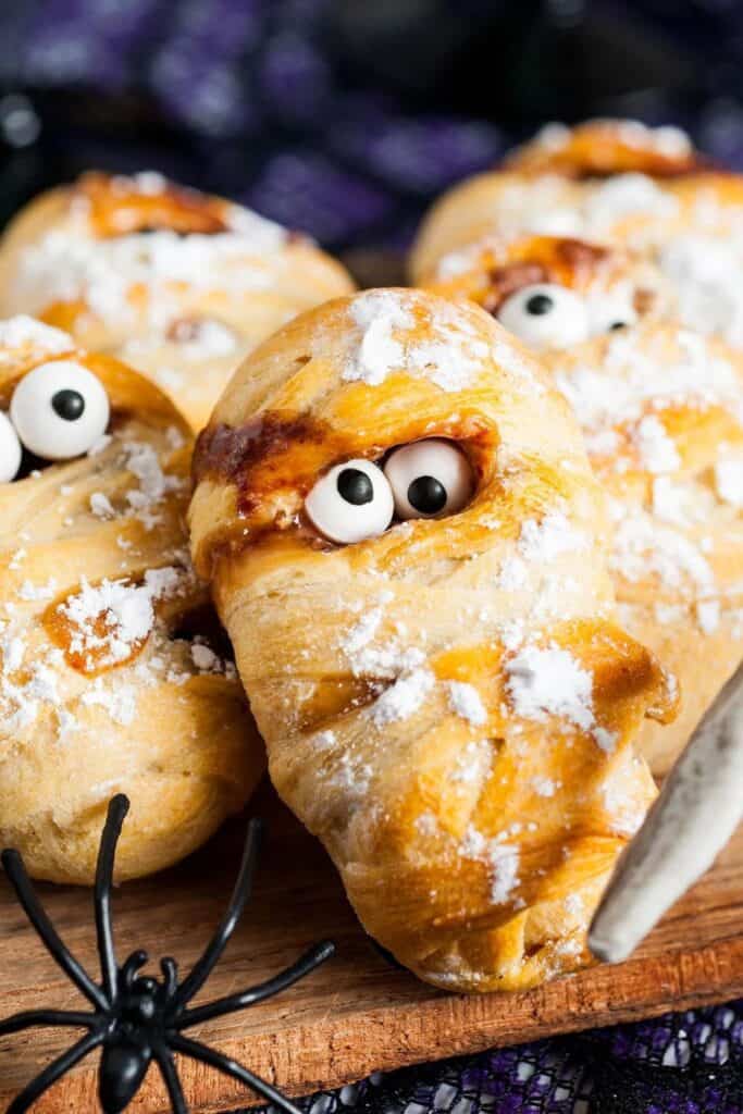 Snickers wrapped pastry mummies with candy eyes. 