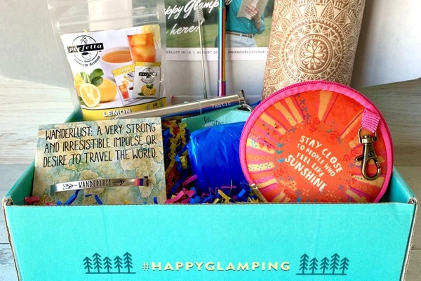 Camping monthly box for glampers. Glamping items in a box,metal straw, purse, bracelets, tea,. 