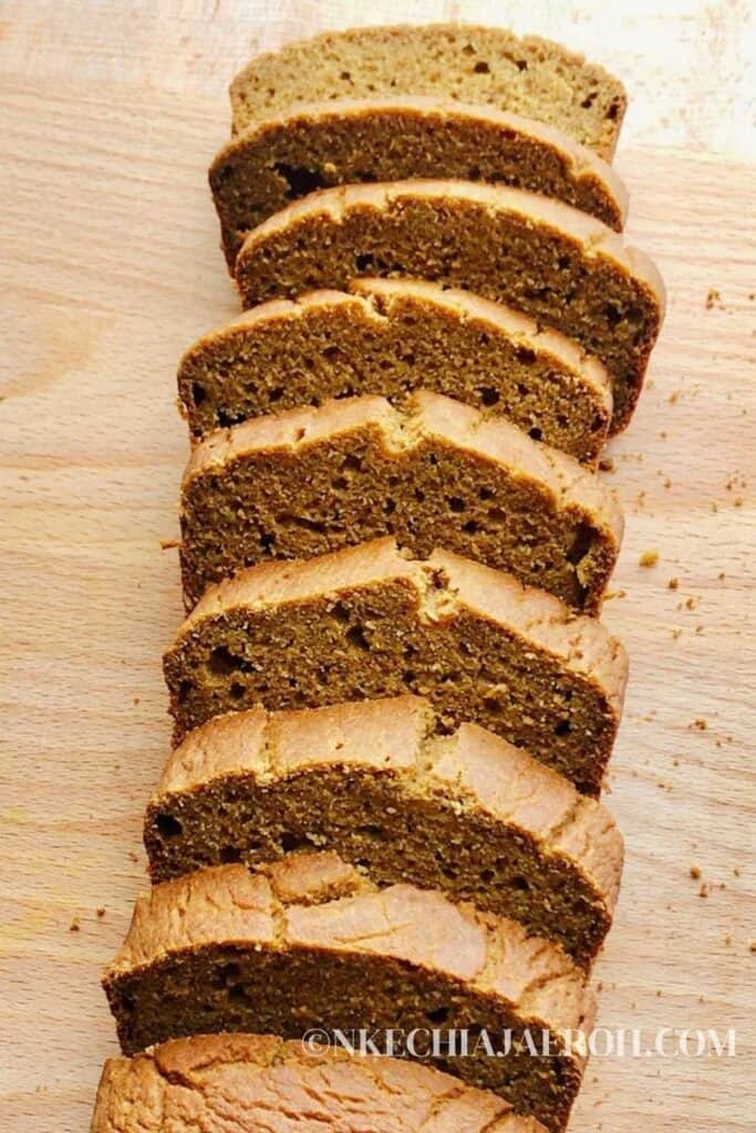 Pumpkin bread cut into 7 slices on a wooden table