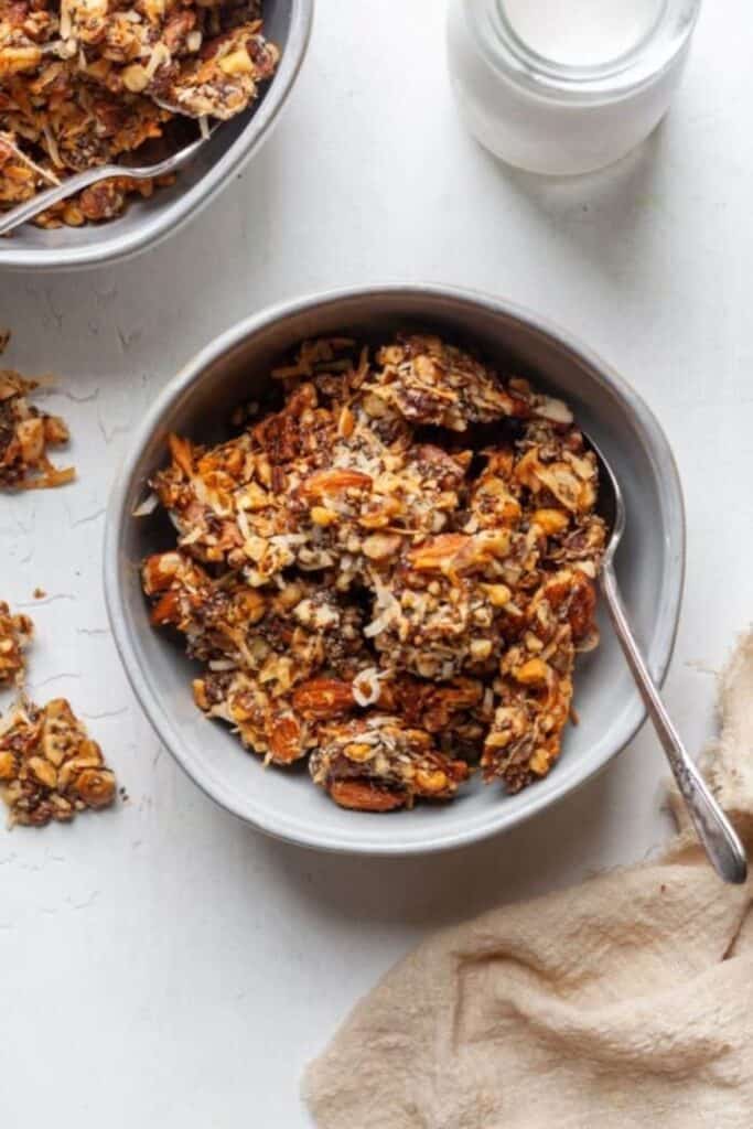 Bowl of homemade granola with dates, and nuts. 