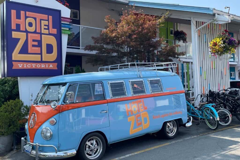 VW Bus in front of Hotel Zed sign in Victoria, BC Canada. 