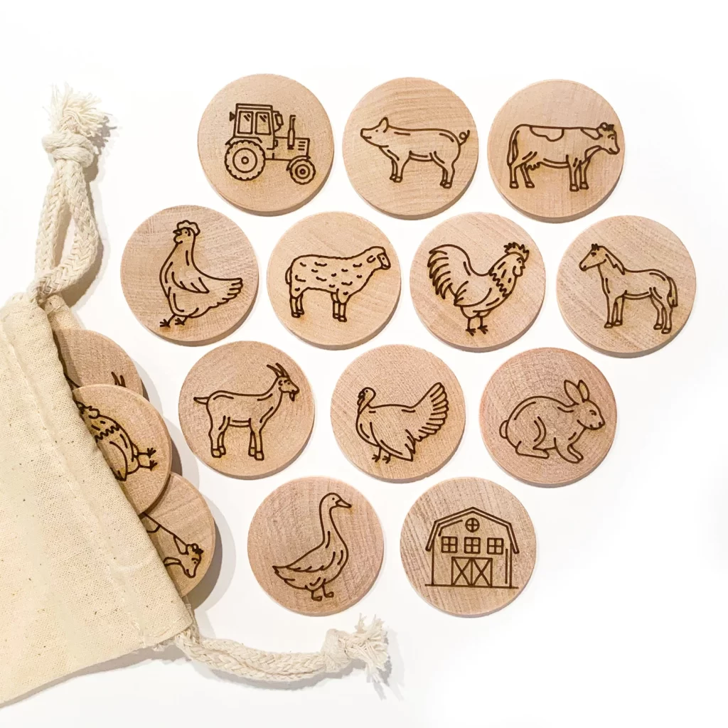 Twelve wooden circles with farm animals to match.Kids eco gift idea wooden match game.