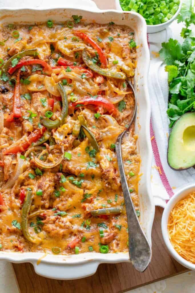 Scallop edged casserole dish with cheesy chicken, peppers fajita casserole.