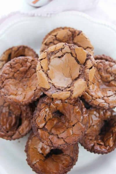 Overhead view of a plate of round mini nutelle brownies.