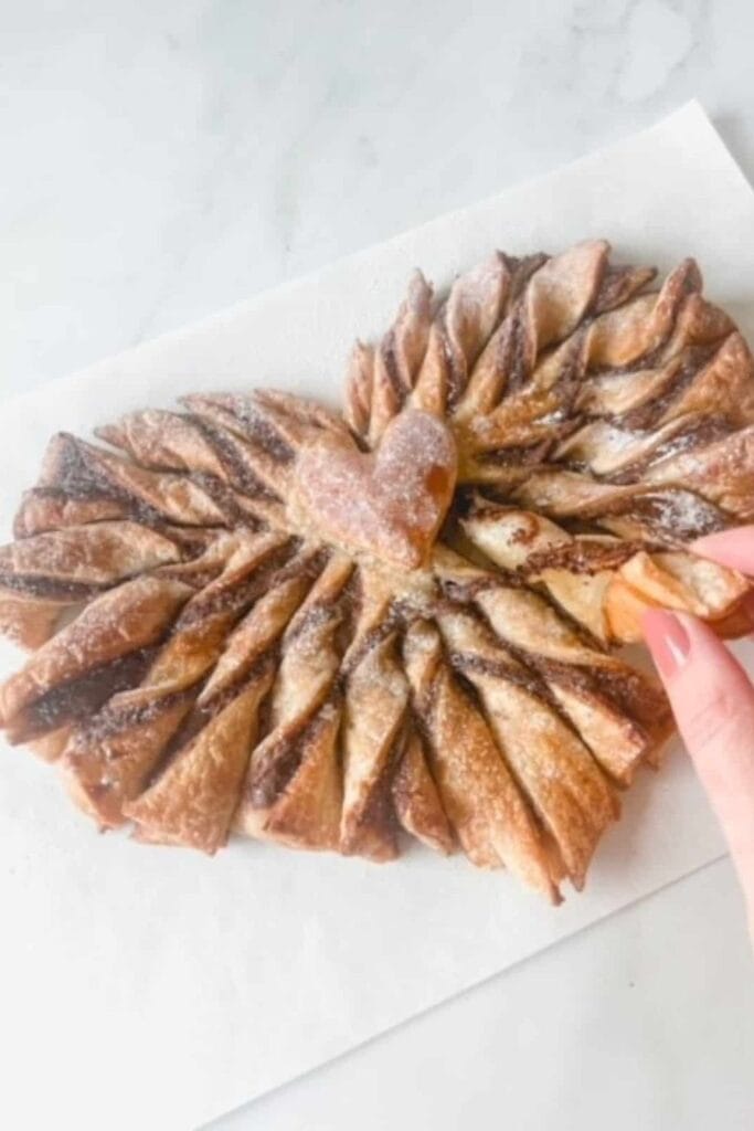 Heart shaped puff pastry twists with nutella