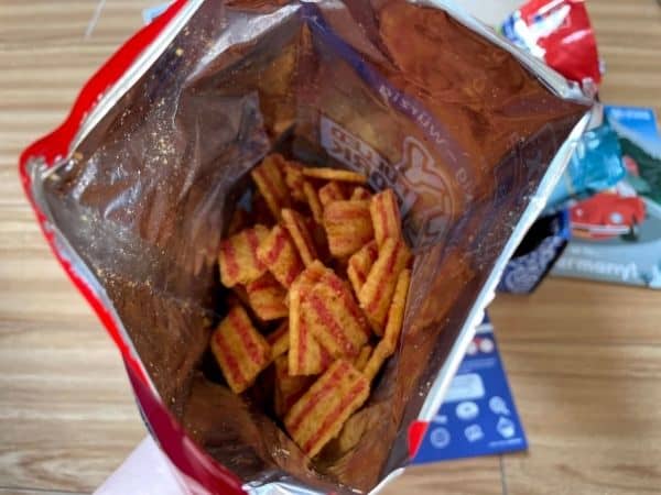 Universal Yums snack box - pork chips in an open bag.