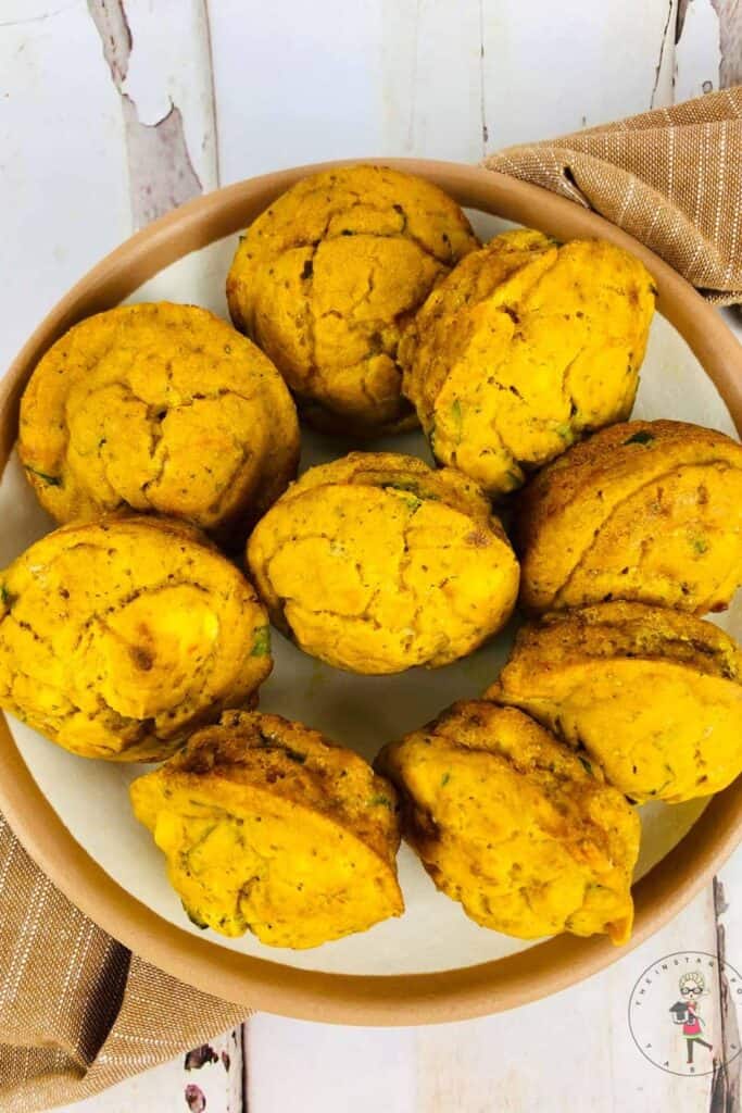 Plate of savory pumpkin feta spinach muffins. 