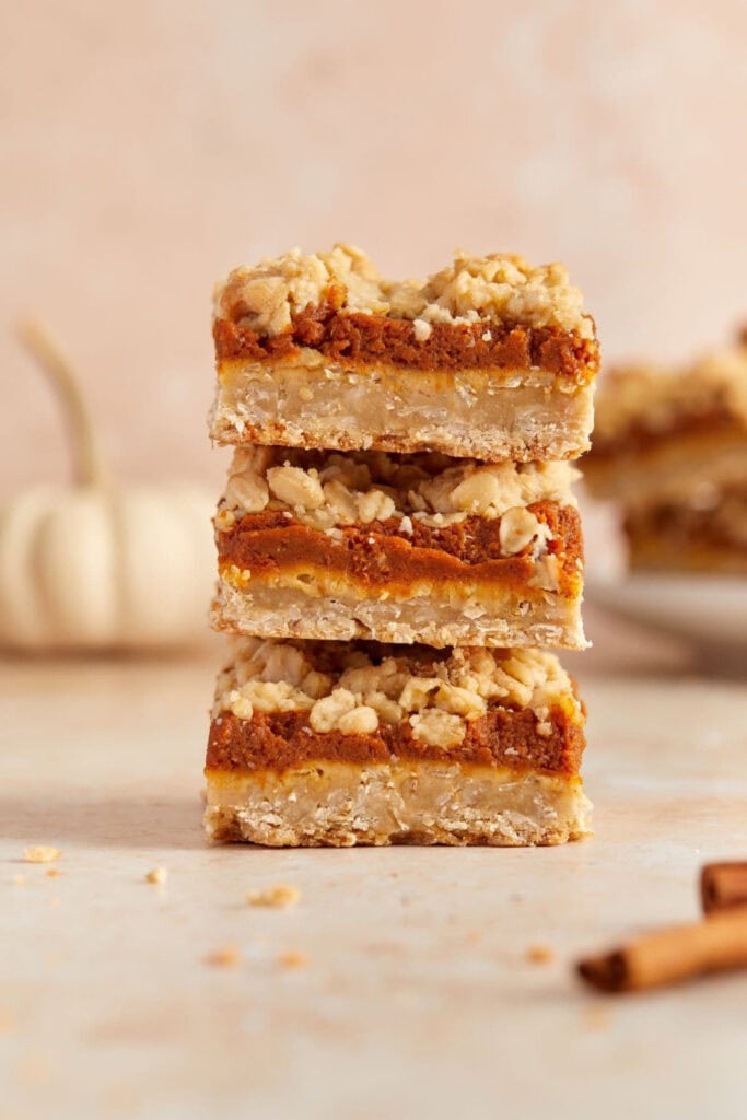 Stack of 3 pumpkin oatmeal bar squares.