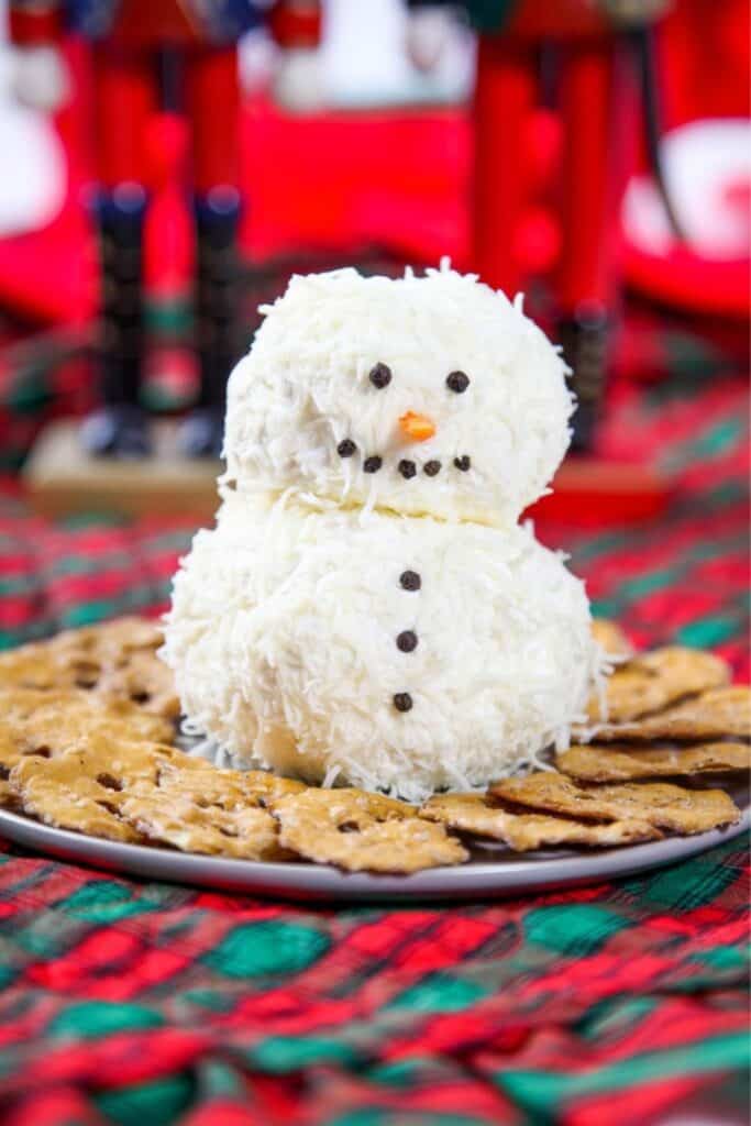 Ranch Cheeseballs shaped like a snowman with pretels around it. 