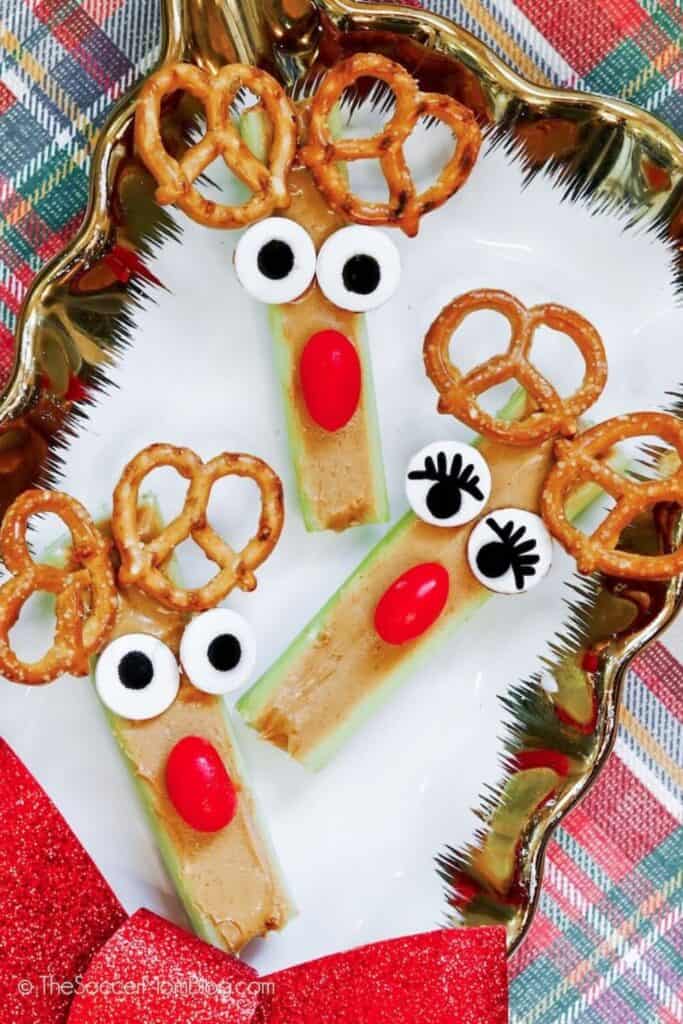 Rudolph the Reindeer celery sticks with peanut butter, candy eyes, pretzel antlers and tomato noses.