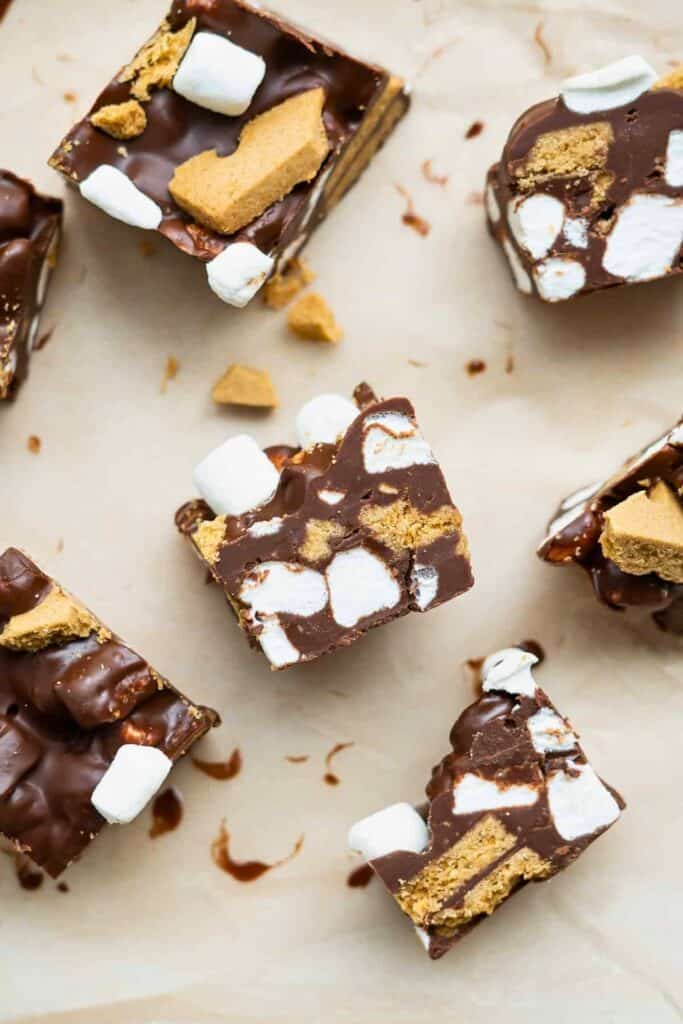 Over head view of Rocky Road S'mores Bites made with rich chocolate, mini marshmallows, and pieces of graham crackers cut into bite sized squares.