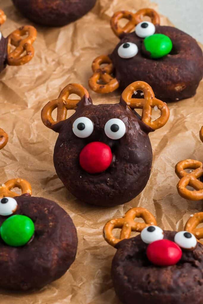 Rudolpn Donuts made out of premade chocolate mini donuts with pretzel antlers, candy eys and M&M nose.