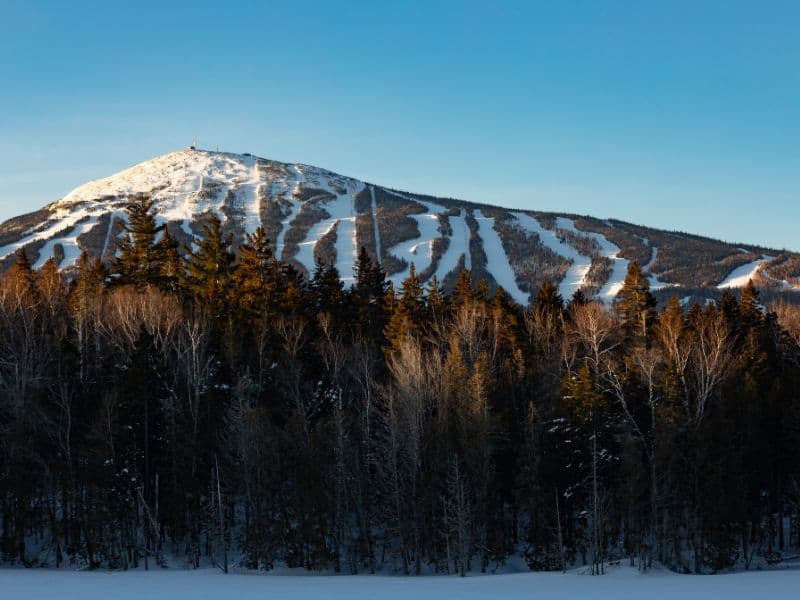 Sugarloaf Mountain in Maine, with ski runs full of snow. 