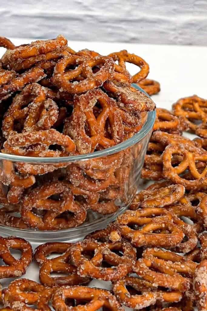 Glass bowl filled with sweet and spicy pretzels snack mix.