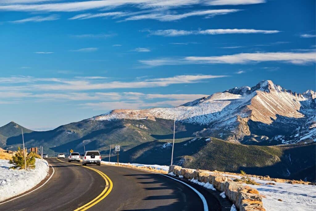 Cars driving along the mountainous Trail Ridge Road in Rocky Mountaon National Park, CO