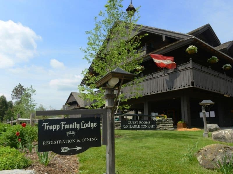 Trapp Family Lodge, wooden building with sign that points to registration and dining.