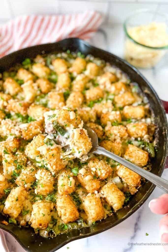 Cast iron skillet with turkey tater tot casserole. 