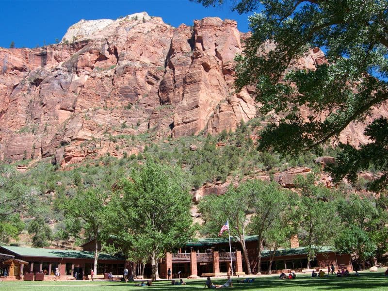Where to stay Zion National Park - Zion Lodge against red rock mountain.
