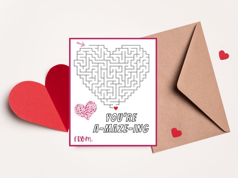 You're A-maze-ing Valentine's Day Card in front of an envelope & cut out paper hearts.